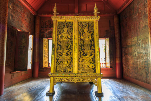 The ancient golden and black Tipitaka Book Cabinet Bangkok, Thailand - August 14, 2017 : The ancient golden and black Cabinet of Old Tripitaka or Buddhist Scriptures in the collection of Buddhist scriptures in Wat Rakang. tipitaka stock pictures, royalty-free photos & images
