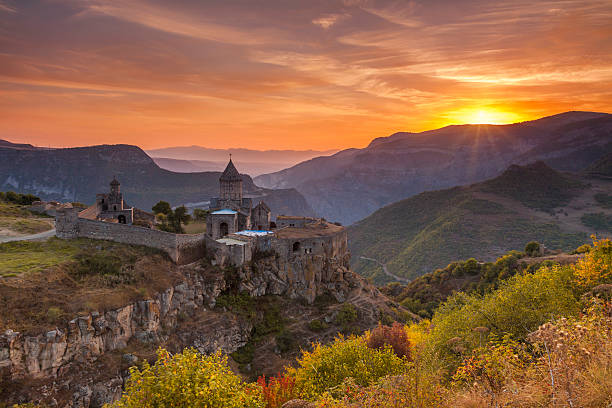 the ancient monastery in the setting sun. tatev. armenia. - armenia stockfoto's en -beelden
