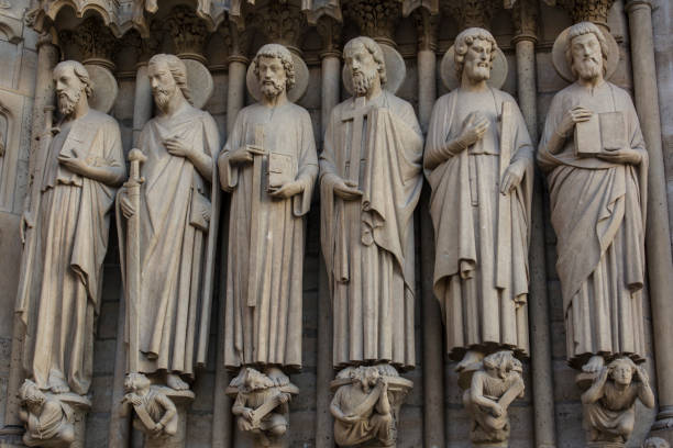 The apostles of Jesus Christ 6 Sculptures  of the twelve apostles of Jesus on the facade of Notre Dame of Paris saints stock pictures, royalty-free photos & images