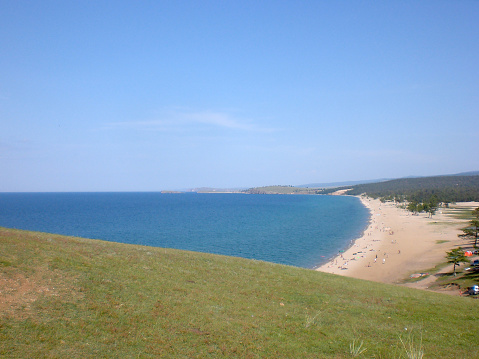 The Beach And The People On The Shore Of Lake Baikal Stock Photo