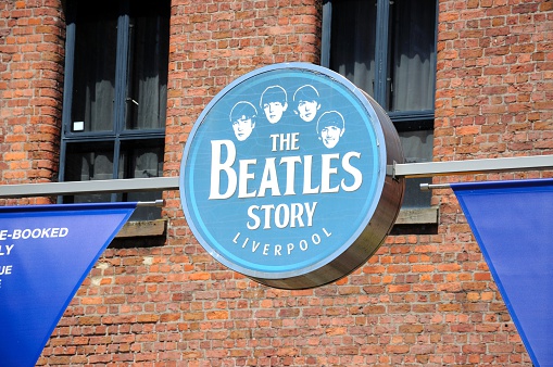 Liverpool, United Kingdom - June 11, 2015: Sign on the outside of The Beatles Story building at Albert Dock, Liverpool, Merseyside, England, UK, Western Europe.