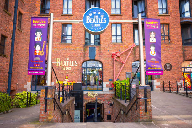 The Beatles Story museum in Loiverpool, UK Liverpool, UK - May 17 2018: The Beatles Story located on the historical Albert Dock, opened on 1 May 1990. The museum was also recognised as one of the best tourist attractions of the United Kingdom in 2015 river mersey liverpool stock pictures, royalty-free photos & images