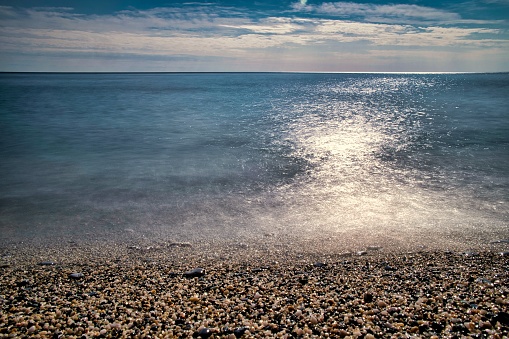 the beautiful silk effect of a long exposure of the Ligurian sea on a warm winter day