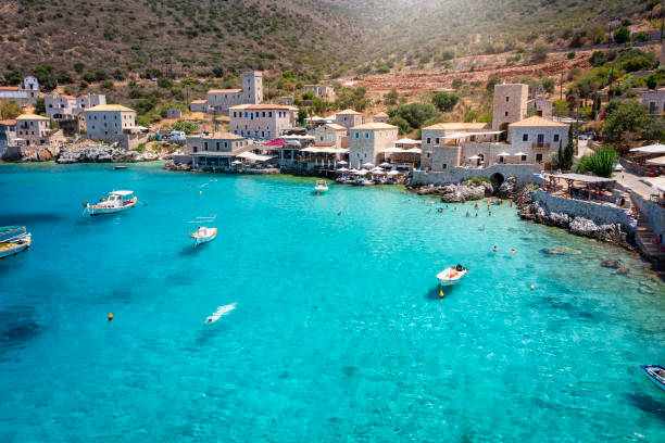 The beautiful village Limeni on the south Mani coast, Peloponnese, Greece The beautiful village Limeni on the south Mani coast, Peloponnese, Greece, with shining, turquoise sea during summer time peloponnese stock pictures, royalty-free photos & images