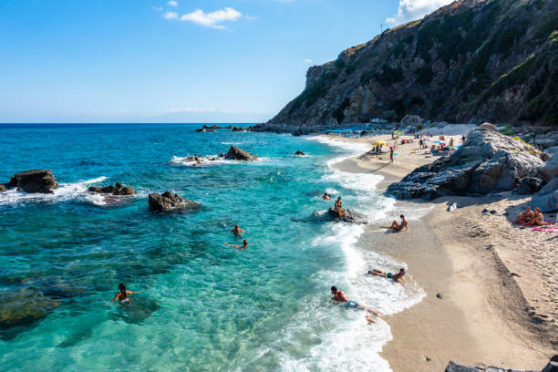 The beautiful Zambrone beach full of tourists an bathers during summertime, Calabria, Italy stock photo