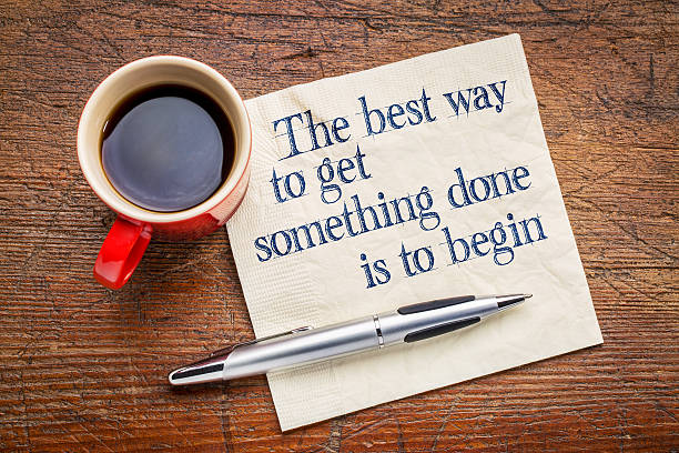 the best way to get something done the best way to get something done is to begin - inspirational phrase on a napkin with cup of coffee wasting time stock pictures, royalty-free photos & images