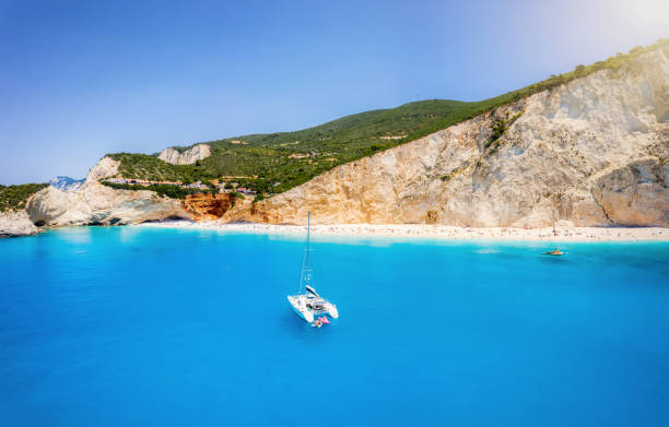 The breathtaking Porto Katsiki beach on the island of Lefkada, Greece The breathtaking Porto Katsiki beach on the island of Lefkada, Greece, with vibrant blue sea and fine pebble beach under the steep chalk cliffs lefkada stock pictures, royalty-free photos & images