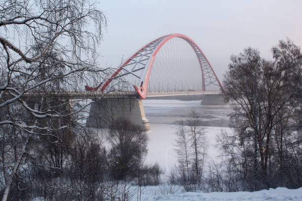The bridge across the Ob river in Novosibirsk in the winter. stock photo
