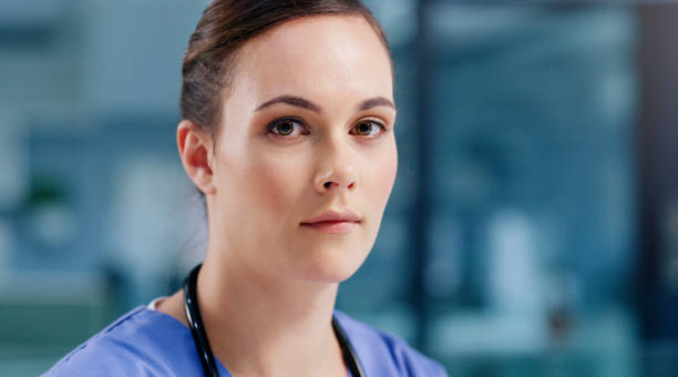 The business of saving lives requires serious commitment Portrait of a young nurse working in a hospital nurse face stock pictures, royalty-free photos & images