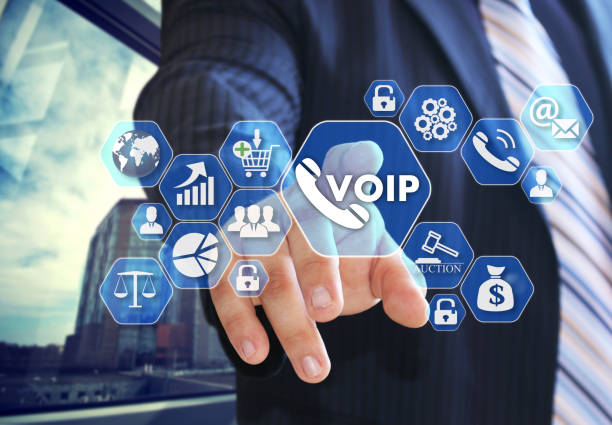 The businessman chooses VOIP on the virtual screen in social network connection. The businessman chooses VOIP on the virtual screen in social network connection. voip stock pictures, royalty-free photos & images