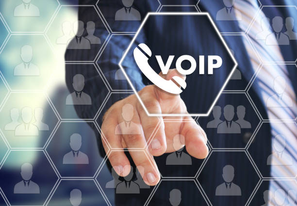 VOIP. The businessman chooses VOIP on the virtual screen in social network connection. stock photo