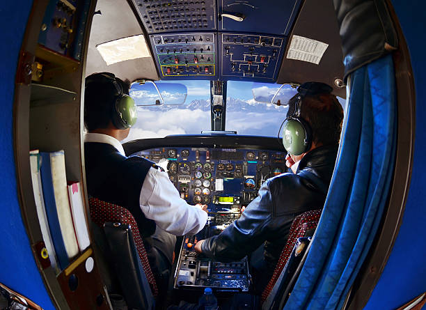 The cabin of the old passenger plane with pilots stock photo