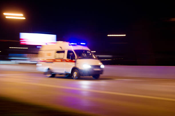 The car rushes on the highway at high speed Photo taken from the roadside ,Moscow, spring 2019, sky, ambulance, road ambulance stock pictures, royalty-free photos & images