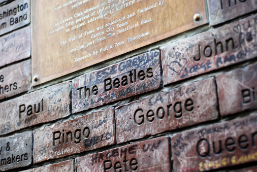 Liverpool, England - February 26, 2011: The Cavern Wall of Fame in Mathew Street, Liverpool. The Cavern Club is a rock and roll club in Liverpool, England. Opened on Wednesday 16 January 1957, the club is where The Beatles had their first performance on 9 February 1961. The cavern wall of fame shows all the bands and singers that have appeared at the famous Cavern club, Mathew street, Liverpool.