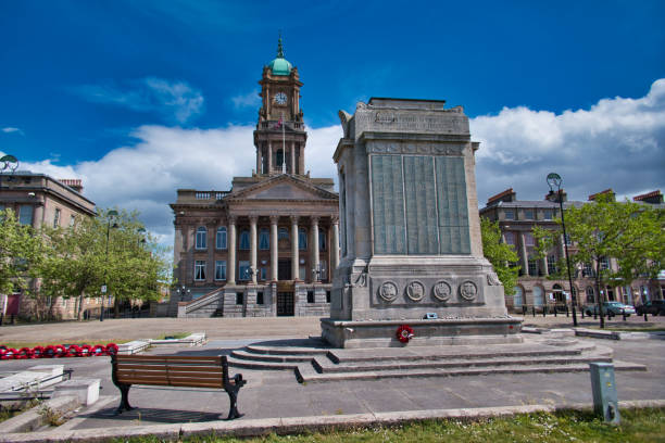 The Cenotaph and Town Hall in Hamilton Square in Birkenhead, Wirral Merseyside, taken on a sunny day with white clouds. The Cenotaph and Town Hall in Hamilton Square in Birkenhead, Wirral Merseyside, taken on a sunny day with white clouds. the wirral stock pictures, royalty-free photos & images