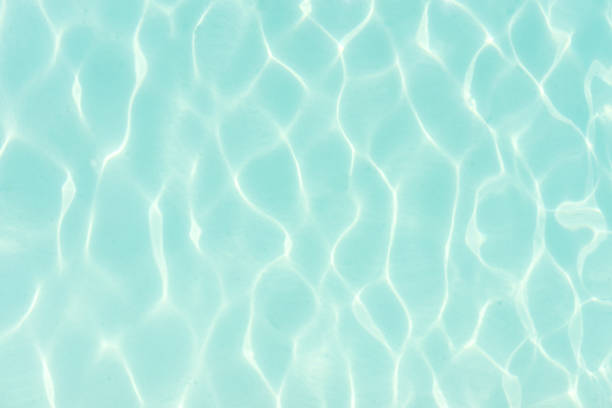 the close up of swimming pool with blue water the fresh blue water of the swimming pool standing water stock pictures, royalty-free photos & images