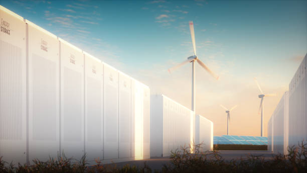 el concepto de ahorro de energía de fuentes renovables. ilustración 3d de un sistema de batería moderna con un fondo de plantas de energía de viento solar en una luz de noche caliente. - batería fotografías e imágenes de stock