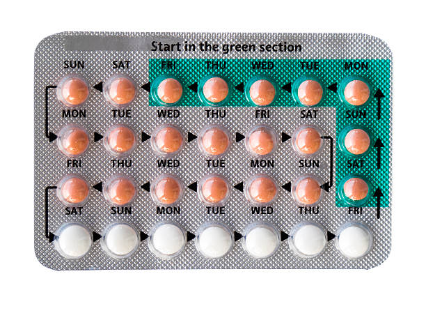The contraceptive pill for a month The contraceptive pill, isolated on white. contraceptive stock pictures, royalty-free photos & images