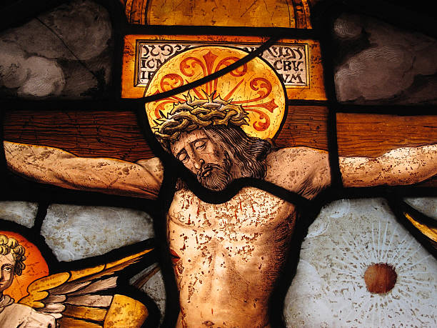 The Crucifixion Medieval Stained Glass The crucifixion of Christ shown in an image on a medieval 16th century stained glass panel the crucifixion stock pictures, royalty-free photos & images