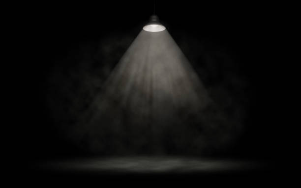 The dark stage is illuminated by a spotlight. White smoke. Background. Bright beams of a spotlight. 3d illustration stock photo