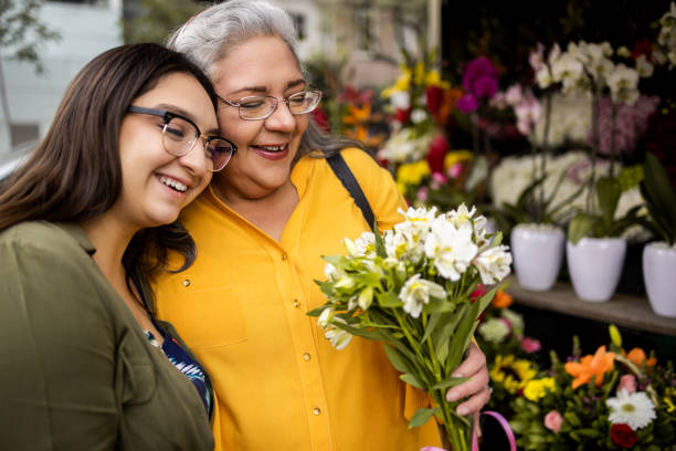 The daughter bought her mother a bouquet of flowers stock photo