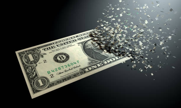 The dematerialization of money, dollars are dematerialized on a black background. stock photo