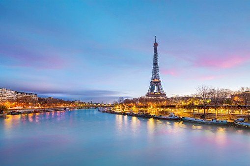 The Eiffel Tower and river Seine at twilight in Paris, France.