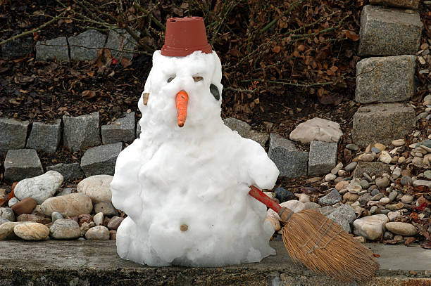 The End  melting snow man stock pictures, royalty-free photos & images