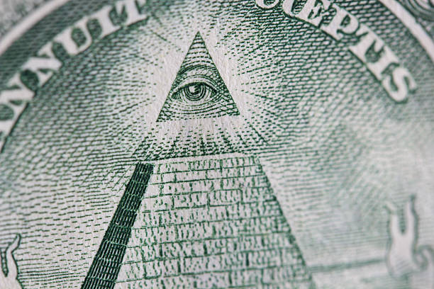 The Eye Of Providence A close up of the eye of providence on a one dollar bill conspiracy stock pictures, royalty-free photos & images