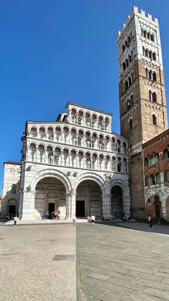 the façade of the eleventh century lucca cathedral (duomo di lucca, cattedrale di san martino) - lucca, tuscany, italy. stock photo