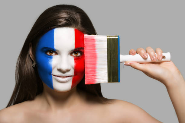 The face of a woman in the national colors of France stock photo