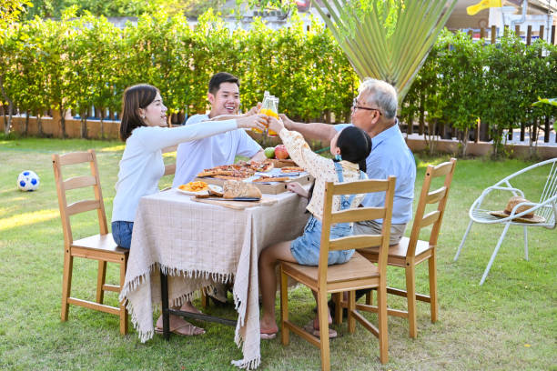 The family gathered for a meal on the holiday, Family garden party celebration on the weekend. stock photo
