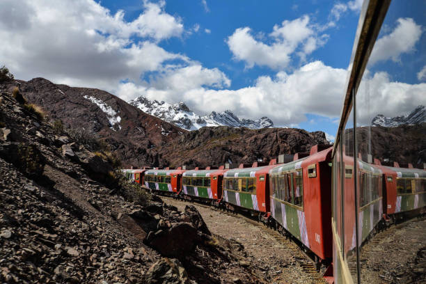 The Ferrocaril Central Andino train, the worlds second highest railroad, crosses the Andes en route from Lima to Huancayo, Peru. stock photo