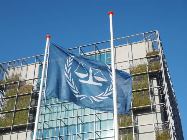 The flag and the main building of International Criminal Court. stock photo