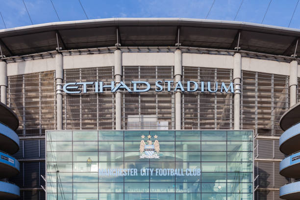 The Frontage of the Etihad Stadium, Home of Manchester City Football Club, in England Manchester, England - May 22, 2016:  The frontage of the Etihad Stadium, home of Manchester City Football Club, in Manchester, England. etihad stadium stock pictures, royalty-free photos & images