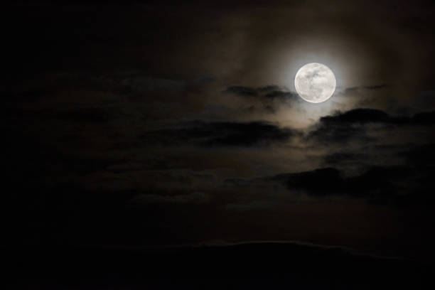 The full moon among the clouds The full moon among the clouds full moon stock pictures, royalty-free photos & images