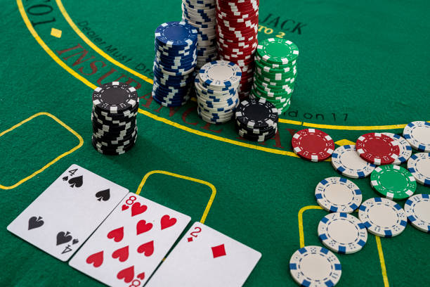 The game chips and palying cards for betting in gambling stock photo