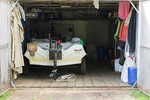 the garage with a motor boat inside stock photo