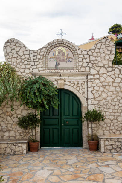 The gate to the monastery of Panagia Mirtidion, Myrtiotissa bay, Corfu, Greece stock photo