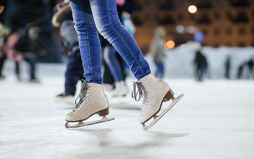 the girl on the figured skates on a skating rink