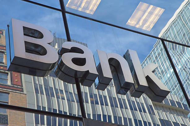 The glass wall with a inscription Bank stock photo