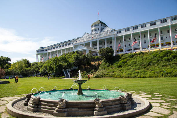 The Grand Hotel On Mackinaw Island In Michigan Mackinaw Island, Michigan, USA - July 8, 2015: Exterior of the landmark Grand Hotel. The historical hotel opened in 1887 and catered to the upper class Victorian era traveler. It remains a world class destination today. mackinac island stock pictures, royalty-free photos & images