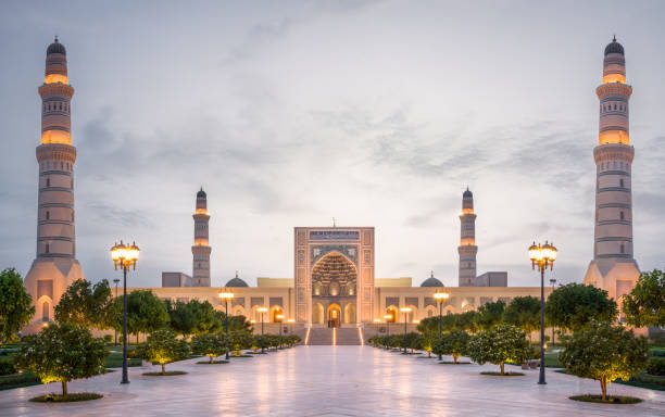 The grand Sultan Qaboos mosque, Sohar, Oman, Middle east. The Spectacular Sultan Qaboos Mosque in the city of Sohar with its marble floor and lights in perfect symmetry after sunset, in the country of Oman in the middle east. oman stock pictures, royalty-free photos & images