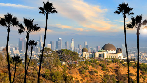 The Griffith Observatory and Los Angeles city skyline The Griffith Observatory and Los Angeles city skyline at sunset CA observatory stock pictures, royalty-free photos & images