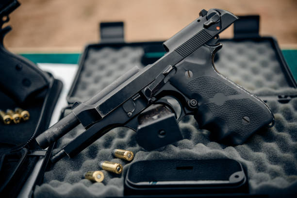 The gun and gun Short black pistol stock photo