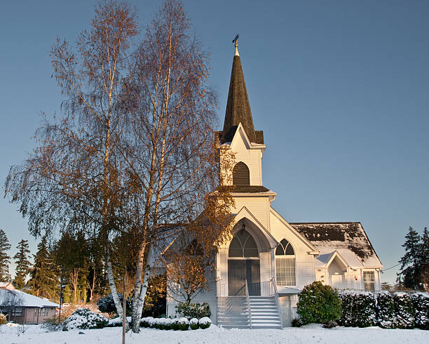 Historic 1904 Church in the Snow at Dusk The historic chapel of Mountain View Lutheran Church was built in 1904. It is located in the town of Edgewood, Washington State, USA. jeff goulden church stock pictures, royalty-free photos & images