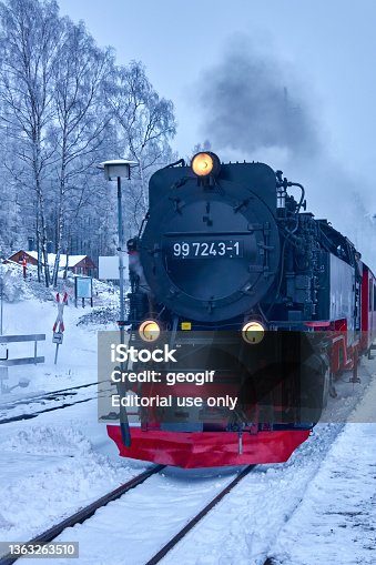 istock The historic steam locomotive of the Harz narrow-gauge railway enters on the snow-covered tracks at the station in front of the Brocken mountain 1363263510
