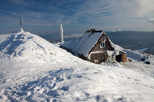 The hut covered with snow. stock photo