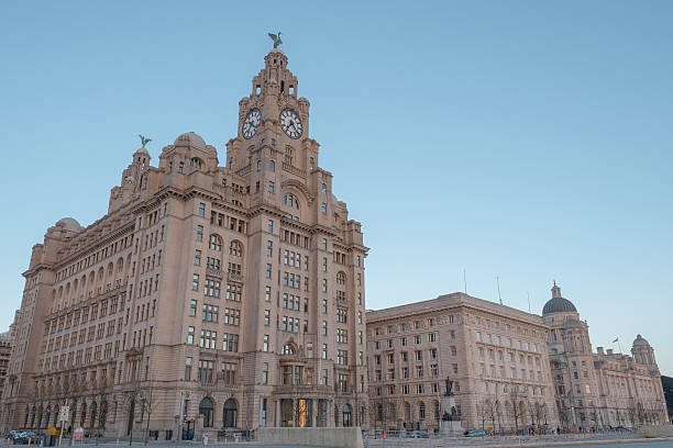 The iconic buildings of Liverpool, the Three Graces Early evening scene of the Three Graces, Liverpool pierhead liverpool stock pictures, royalty-free photos & images