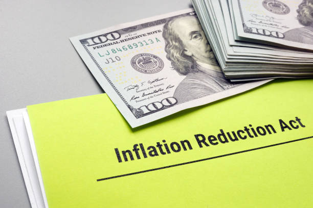 The Inflation Reduction Act of 2022 and cash on it. stock photo